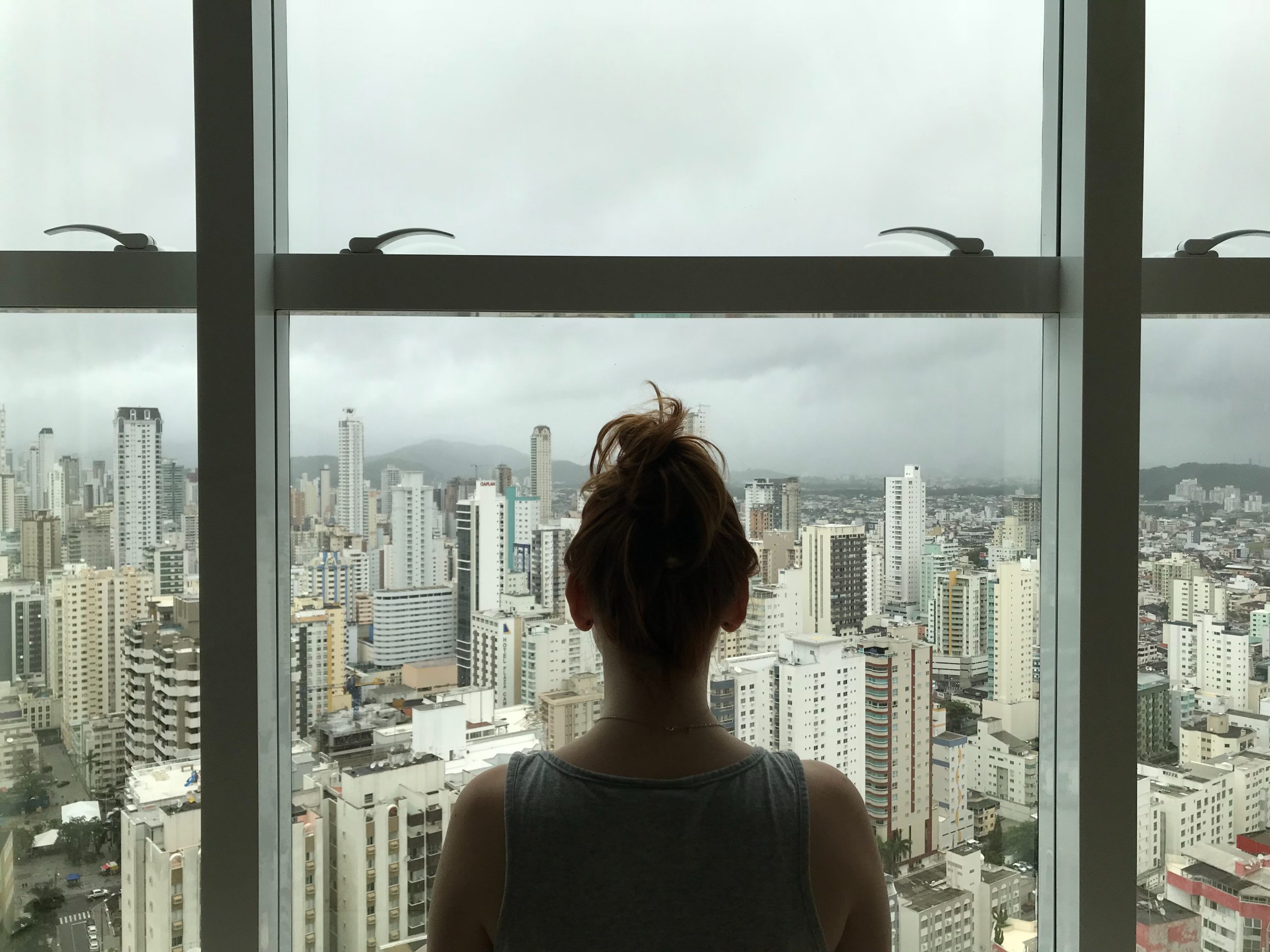 woman-standing-near-glass-window-763849