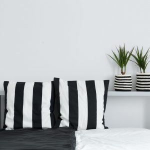 black and white cushions and plants